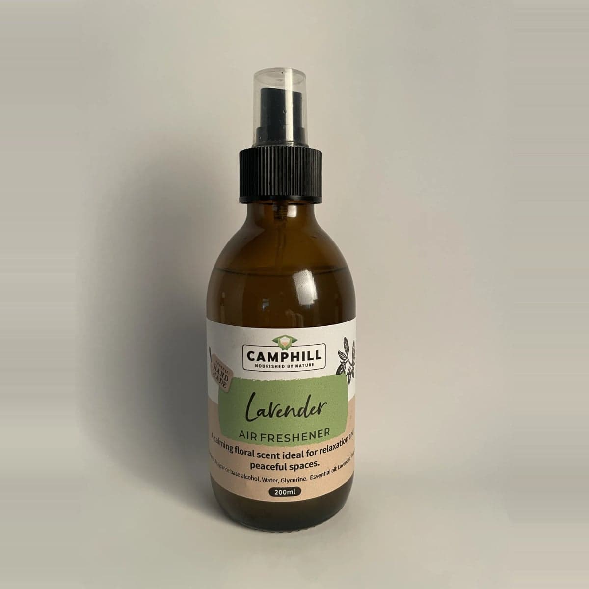 A 200ml amber glass spray bottle of Camphill Lavender Air Freshener, described on the label as a calming floral scent ideal for relaxation and peaceful spaces.