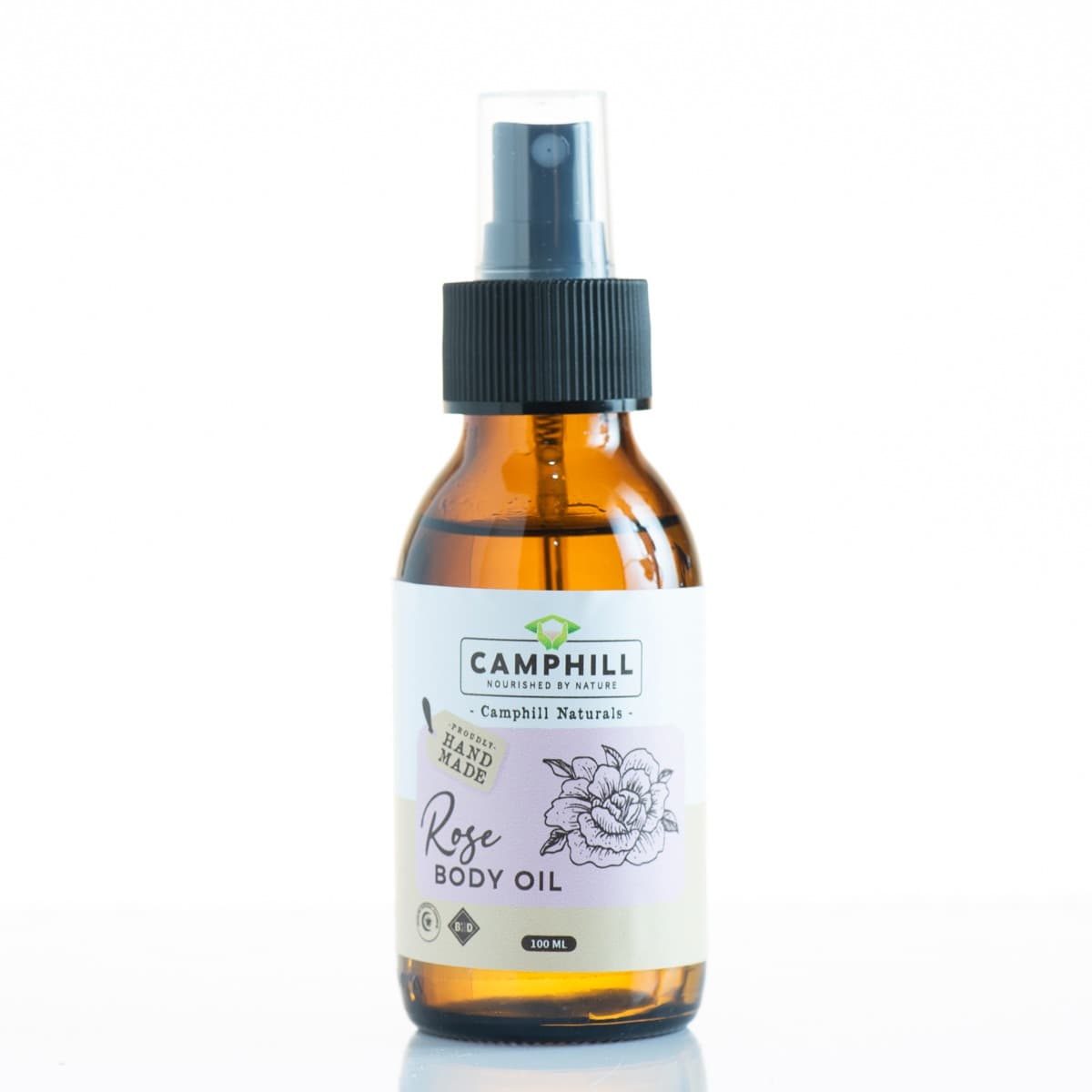 A 100ml amber spray bottle of Camphill Rose Body Oil.
