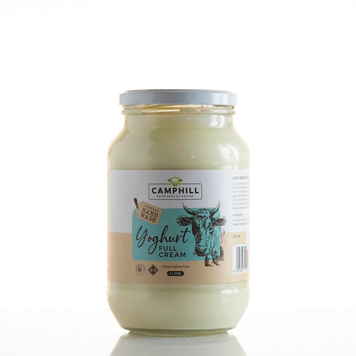Glass jar of Camphill full cream yoghurt with a cow illustration on the label