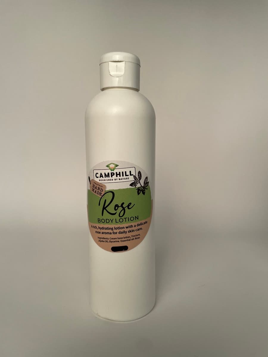 A 250g white bottle of Camphill Rose Body Lotion.