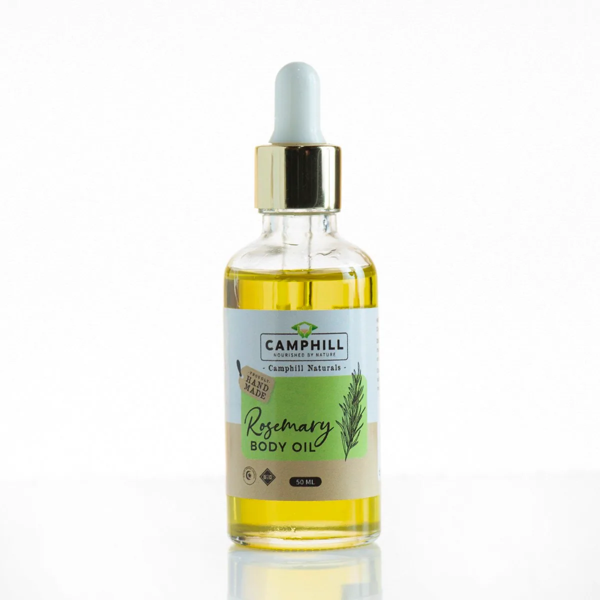 Clear glass dropper bottle of Camphill Naturals rosemary body oil